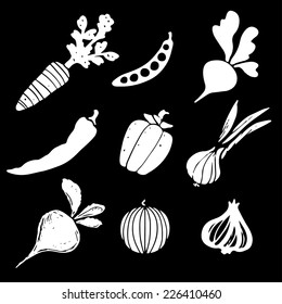 Vegetables silhouettes set, funny hand drawn icons isolated on a black background. Art logo design