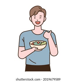 Vegetarian character. A man is holding a salad bowl and thumbs up. flat design style minimal vector illustration.