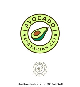 Vegetarian restaurant logo. cafe emblem. Avocado icon. Avocado one cut in half with bone and letters in a green circle.