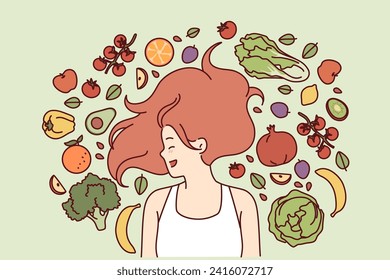 Vegetarian woman lies among fresh fruits and vegetables, rejoicing at opportunity to eat organic food. Vegetarian girl with fluffy hairstyle comes up with recipe for new salad from farm ingredients