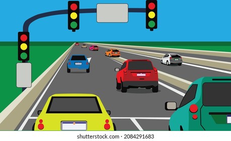 vehicles on the road and traffic light with blue sky