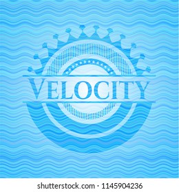 Velocity light blue water wave style badge.