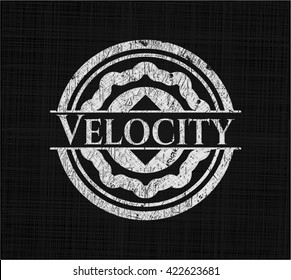Velocity written on a chalkboard