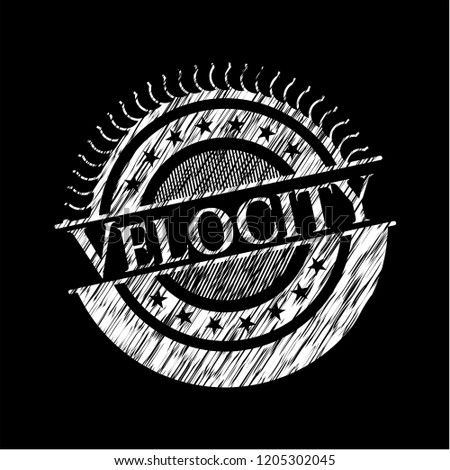 Velocity written on a chalkboard