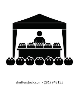Vendor standing behind market stall with various fruits and vegetables on display for sale