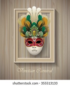 Venetian carnival mask with colorful feathers in border