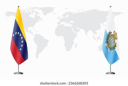 Venezuela and San Marino flags for official meeting against background of world map.