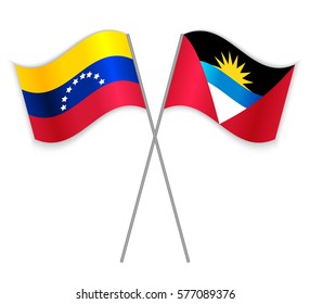Venezuelan and Antiguan crossed flags. Venezuela combined with Antigua and Barbuda isolated on white. Language learning, international business or travel concept.