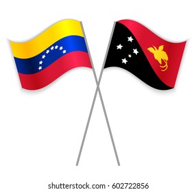 Venezuelan and Papuan crossed flags. Venezuela combined with Papua New Guinea isolated on white. Language learning, international business or travel concept.