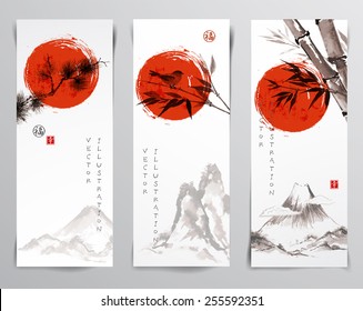 Vertical banners with mountains, bird, bamboo branches, pine tree branch and rising sun. Traditional Japanese painting sumi-e. Sealed with hieroglyphs "luck' and "happiness"