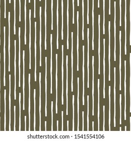 Vertical broken up grunge lines in random geometric tribal design. Seamless vector pattern on earthy brown background. Great for wellbeing, food products, summer, packaging, stationery, texture, blog