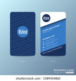 Vertical business card design with zigzag line pattern on dark blue background