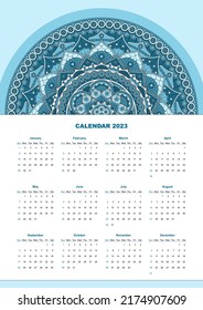 Vertical calendar for 2023 year with blue mandala pattern. Week starts on sunday.