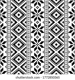 Vertical Christmas Ethnic pattern on white background. Ornament. Border. Seamless sample. It can be used as a background. Vector illustration