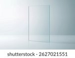 Vertical clear glass rectangle on reflective white surface, clean minimal background