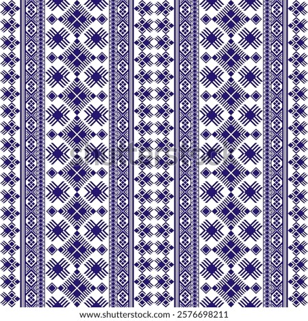 a vertical geometric pattern in dark blue on a white background. It features intricate motifs, including diamonds and crosses, arranged in symmetrical vertical stripes. Vector ethnic geometry seamless