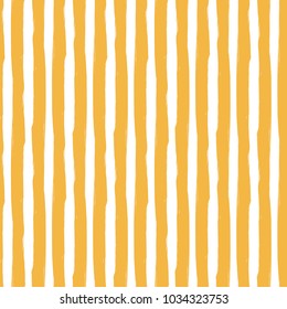 Vertical lines yellow pattern. Seamless brush stripes background.