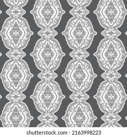 vertical medallion stripe. seamless repeating in grays