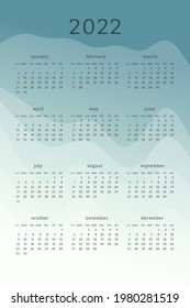 Vertical mint green calendar for 2022 year. Mountains silhouettes abstract gradient colorful background. Calendar design for print and digital. Week starts on Sunday