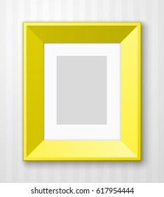 Vertical Photo frame with paper passepartout for picture hanging on wall with striped wallpaper background.