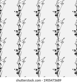 Vertical seamless pattern with silhouettes of a flower branch on a white background