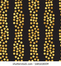 Vertical stripes of golden hexagons seamless vector pattern on a black background. Abstract surface print design. Great for fabrics, stationery and packaging.