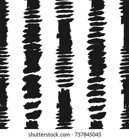 Vertical stripes painted with brush strokes. Seamless pattern. Grunge, sketch, graffiti, watercolor. Black strips on white background. Vector illustration.
