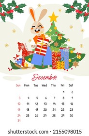 Calendario vectorial vertical para diciembre de 2023 con una caja de regalo para conejo navideño adorable. El año del conejo, símbolo del conejo del 2023. La semana empieza el domingo