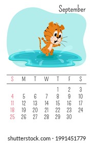 Vertical Wall calendar page template for September 2022 with a cartoon tiger symbol of the Chinese year. The week starts on Sunday. A tiger jumps in a puddle