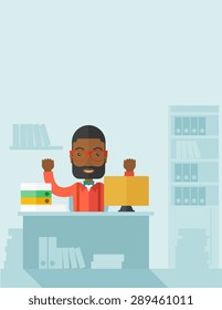 A very happy black businessman sitting while raising his both hand finished his work with laptop and paper works on time inside his office. Achievement concept. A Contemporary style with pastel