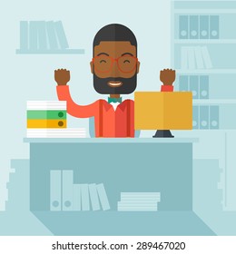 A very happy black businessman sitting while raising his both hand finished his work with laptop and paper works on time inside his office. Achievement concept. A Contemporary style with pastel