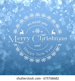 A Very Merry Christmas card in blue color, with shining bokeh and sparkles