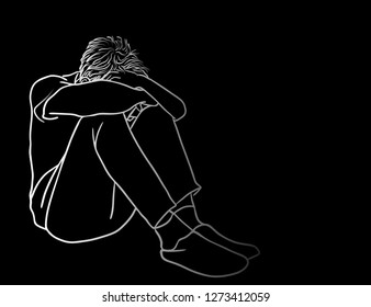 Very sad man sitting alone with headache touching forehead on black background.