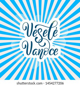 Vesele Vanoce on Czech language, phrase translate Merry Christmas. Happy winter holiday postcard with hand lettering holiday quote. Czech calligraphy on blue sun background.