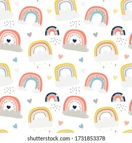 Vetor seamless pattern with cute rainbows. Pattern for baby girl room, wallpaper, kids and baby t-shirts and wear, hand drawn nursery illustration