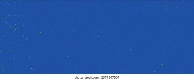 Vibrant blue background with a speckled texture. The background is a deep blue with scattered green specks, creating a dynamic blue effect. Speckled wall texture background. Blue background vector.