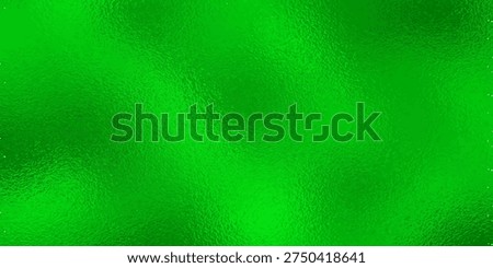 Vibrant green metallic foil texture with sparkling reflective surface for holiday and luxury background design