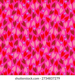 Vibrant heart seamless pattern of various colors including dark pink, light pink, red, and reddish brown with small light blue hearts are interspersed throughout the image on pink background design.
