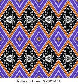 A vibrant and intricate Thai batik pattern featuring a repeating diamond shape motif. The design incorporates a harmonious blend of purple, black, white, and orange hues. This traditional textile patt