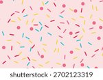 A vibrant seamless pattern featuring colorful sprinkles and dots scattered across a soft pink background, evoking a sweet and festive confectionery theme.