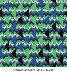 Un diseño textil vibrante con un patrón sin fisuras de triángulos verdes y azules sobre un fondo verde hierba. 