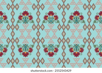 A vibrant textile pattern featuring bold red flowers, intricate geometric motifs, and delicate green accents on a soft pastel blue background