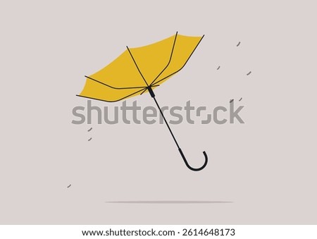 Vibrant yellow umbrella flips inside out, swirling in the gusty wind, capturing the essence of a whimsical moment against a gray backdrop, as rain begins to fall