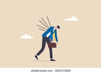 Victim from business betrayal, pain from failure or stressed, anxiety and violence by social bullying, overworked problem concept, depressed exhausted businessman walking with painful bows on his back