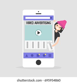 Video advertising on a mobile screen. Young female character interested in an advertising. Tear-off ad. Flat editable vector illustration, clip art. Efficient ad format for millennials