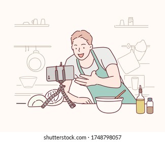 Video blogger in front of came in kitchen. Cooker streaming video in his channel.  Hand drawn style vector design illustrations.