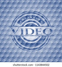 Video blue badge with geometric pattern.