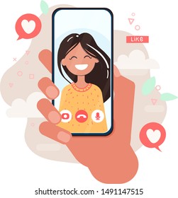 Video call with loved one. Male hand holding smartphone with girlfriend on screen. Finger touch screen. 