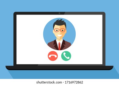 Video call on laptop screen.
