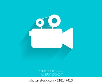 Video camera icon with long shadow on blue background